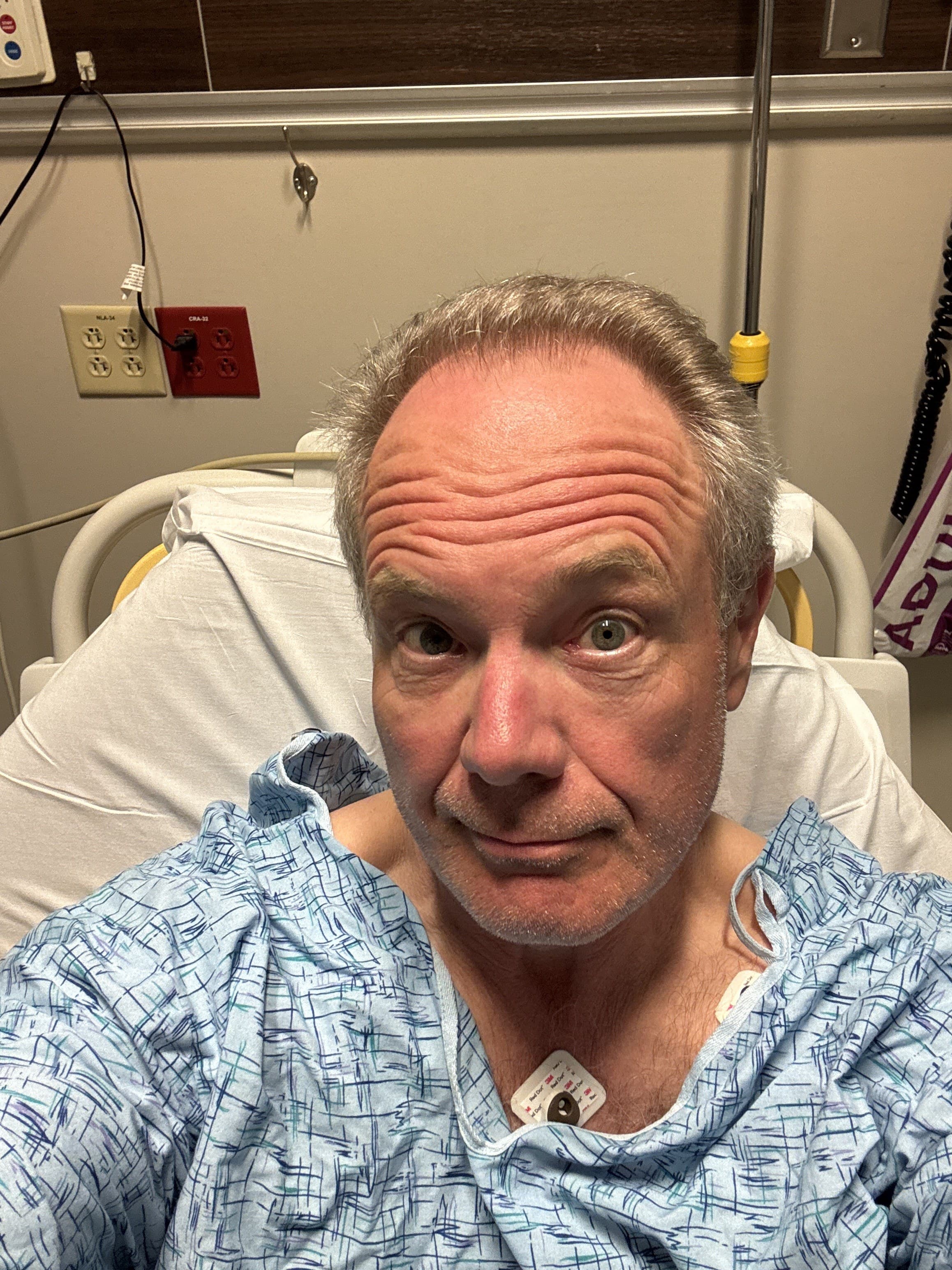 David in a hospital gown shortly after open-heart surgery